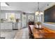 Eat-in kitchen features a dining table, stainless steel appliances, and white cabinetry at 317 Calgary Dr, Peachtree City, GA 30269