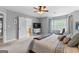 Inviting primary bedroom featuring a ceiling fan, TV, and plush carpet at 317 Calgary Dr, Peachtree City, GA 30269