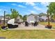 Inviting patio with comfortable seating, a cozy fire pit, and string lights perfect for outdoor relaxation at 317 Calgary Dr, Peachtree City, GA 30269