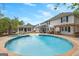Backyard with a large in-ground pool, hot tub, and patio area perfect for entertaining at 317 Calgary Dr, Peachtree City, GA 30269