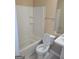 A bathroom featuring a toilet, bathtub and shower combination, and a sink with vanity at 5128 Running Fox Trl, Norcross, GA 30071
