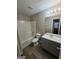 Well-lit bathroom with a combined shower and tub, vanity, toilet, and modern fixtures at 6206 Flat Trace, South Fulton, GA 30291
