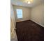 Cozy bedroom with neutral walls, plush carpeting, and a bright window with natural light at 6206 Flat Trace, South Fulton, GA 30291