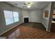 A living room with a fireplace, and window with dark brown flooring adjacent to the kitchen at 6206 Flat Trace, South Fulton, GA 30291