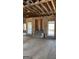 Living room under construction, studs, plumbing, and fireplace flue, in need of repair at 8828 Patricia Rose, Douglasville, GA 30134