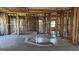 View of Living room under construction with studs, doorway, and electrical boxes at 8828 Patricia Rose, Douglasville, GA 30134