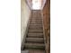 Unfinished staircase featuring concrete steps with exposed framing and natural light at 8828 Patricia Rose, Douglasville, GA 30134