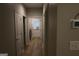 Hallway with luxury vinyl flooring leading to a laundry room and back door at 320 Sharon Dr # A & B, Fayetteville, GA 30214