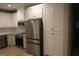 Bright kitchen boasts ample storage with white cabinets and stainless steel appliances at 320 Sharon Dr # A & B, Fayetteville, GA 30214