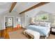 Spacious bedroom with vaulted ceiling, exposed beams, and ensuite bath access at 171 Westminster Ne Dr, Atlanta, GA 30309