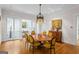 Dining room with hardwood floors, chandelier and doors to exterior porch at 171 Westminster Ne Dr, Atlanta, GA 30309