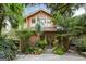 Charming two-story home with mature trees, lush landscaping, and inviting stone walkway at 171 Westminster Ne Dr, Atlanta, GA 30309