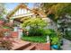 Beautiful home exterior with mature landscaping, brick walkway, and inviting front porch appeal at 171 Westminster Ne Dr, Atlanta, GA 30309
