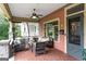 Inviting front porch features comfortable seating, decorative tile flooring, and classic architectural details at 171 Westminster Ne Dr, Atlanta, GA 30309
