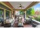 Spacious front porch with ample seating, classic columns, and lovely views of the surrounding landscape at 171 Westminster Ne Dr, Atlanta, GA 30309