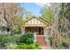 Charming craftsman home featuring a landscaped front yard with brick stairs and a covered porch at 171 Westminster Ne Dr, Atlanta, GA 30309