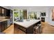 Open concept kitchen with bar stool seating and views to the backyard at 171 Westminster Ne Dr, Atlanta, GA 30309