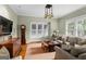 Inviting living room with hardwood floors, custom lighting, and comfortable seating at 171 Westminster Ne Dr, Atlanta, GA 30309