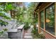 Outdoor kitchen with built-in grill nestled in a tranquil garden setting at 171 Westminster Ne Dr, Atlanta, GA 30309