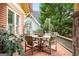 A cozy side patio with a wooden table and chairs offers an intimate outdoor dining space at 171 Westminster Ne Dr, Atlanta, GA 30309