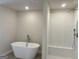 Bright bathroom boasts a modern soaking tub, separate shower, and sleek fixtures for a spa-like experience at 5322 Tolar Rd # 27, South Fulton, GA 30213