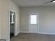 Light-filled bedroom showcasing plush carpeting, a ceiling fan, and an ensuite bathroom with a door to outside at 5322 Tolar Rd # 27, South Fulton, GA 30213