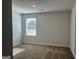Bright bedroom with neutral carpet, a window view and fresh paint offers a serene, adaptable living space at 5322 Tolar Rd # 27, South Fulton, GA 30213