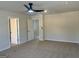 Bedroom with neutral carpet, ceiling fan, and open doorway at 5322 Tolar Rd # 27, South Fulton, GA 30213