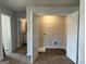 Walk-in closet with open door to a bathroom; also features wire shelving and laundry hookups at 5322 Tolar Rd # 27, South Fulton, GA 30213