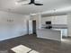 Open-concept kitchen and living area with stainless appliances and modern light fixtures at 5322 Tolar Rd # 27, South Fulton, GA 30213