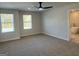 Spacious primary bedroom with carpet flooring, natural light, and ensuite bath at 5322 Tolar Rd # 27, South Fulton, GA 30213