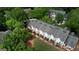 An aerial view of the townhome complex displaying multiple units, decks, landscaping and ample parking at 2160 Dillard Xing, Tucker, GA 30084