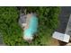 Aerial view of the community pool surrounded by lush landscaping at 2160 Dillard Xing, Tucker, GA 30084