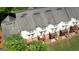 An aerial view shows several townhomes with backyard decks, patios, and landscaping at 2160 Dillard Xing, Tucker, GA 30084