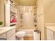 Standard bathroom with a bathtub with a shower, toilet, cabinet and vanity with sink at 2160 Dillard Xing, Tucker, GA 30084