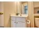 Bathroom featuring a white vanity and mirror, toilet, and view through the door of the shower stall at 2160 Dillard Xing, Tucker, GA 30084