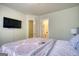 Bedroom with a bed, a view of the en-suite bathroom and walk-in closet and a television set at 2160 Dillard Xing, Tucker, GA 30084