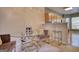 Bright dining area features a stylish glass table with seating for three and modern lighting at 2160 Dillard Xing, Tucker, GA 30084