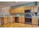 Spacious kitchen featuring wood floors, stainless steel appliances, and a tile backsplash at 2160 Dillard Xing, Tucker, GA 30084