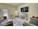 Cozy living room with decorative fireplace, television, mirror and comfortable seating area at 2160 Dillard Xing, Tucker, GA 30084