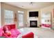 Inviting living room with plush sofa, fireplace, and ample natural light creating a cozy atmosphere at 2160 Dillard Xing, Tucker, GA 30084