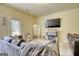 Cozy living room with decorative fireplace, television, and comfortable seating area at 2160 Dillard Xing, Tucker, GA 30084