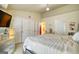 Spacious main bedroom with a closet, an en-suite, a mirrored dresser and a television set at 2160 Dillard Xing, Tucker, GA 30084