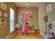 Eclectic office space featuring bright natural light, fun decor, and wooden floors at 2160 Dillard Xing, Tucker, GA 30084