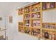 Stylish bar area featuring custom wood shelving displaying an array of liquors and glassware at 7523 Kimberly Lynn Ct, Lithonia, GA 30058