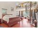 Spacious bedroom boasts a spiral staircase leading to a loft and plenty of natural light at 7523 Kimberly Lynn Ct, Lithonia, GA 30058