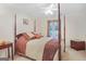 Bedroom with four-poster bed, neutral carpet, and ceiling fan at 7523 Kimberly Lynn Ct, Lithonia, GA 30058
