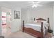 Bedroom with hardwood furniture, neutral carpeting, and ensuite bathroom at 7523 Kimberly Lynn Ct, Lithonia, GA 30058