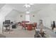 Attic converted to bonus room with carpet flooring, ceiling fans and sitting area at 7523 Kimberly Lynn Ct, Lithonia, GA 30058