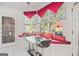 Cozy breakfast nook with large windows, built-in seating, and glass table at 7523 Kimberly Lynn Ct, Lithonia, GA 30058